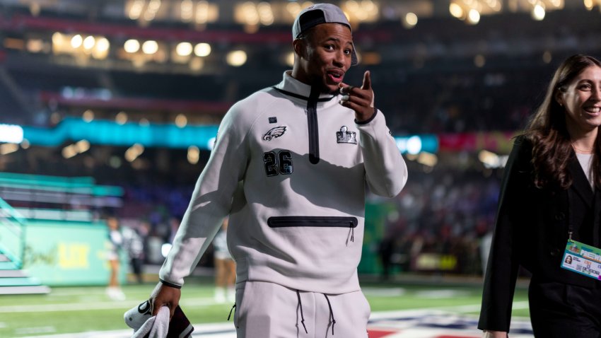 NEW ORLEANS, LOUISIANA – FEBRUARY 3: Saquon Barkley #26 of the Philadelphia Eagles reacts as he walks to his booth during Super Bowl LIX Opening Night on February 02, 2025 in New Orleans, Louisiana.  (Photo by Michael Owens/Getty Images)