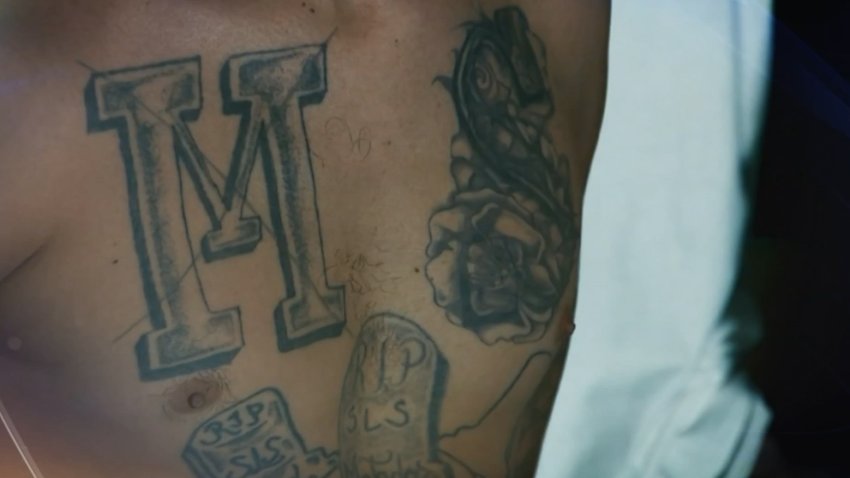 An MS-13 tattoo on a man's chest.