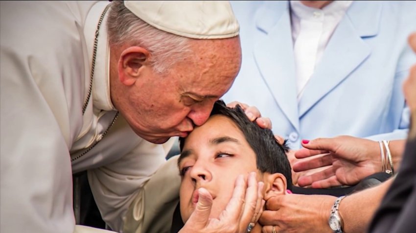 Pope Francis kisses Chester County's Michael Keating, who has cerebral palsy, during his visit to the area in 2015.