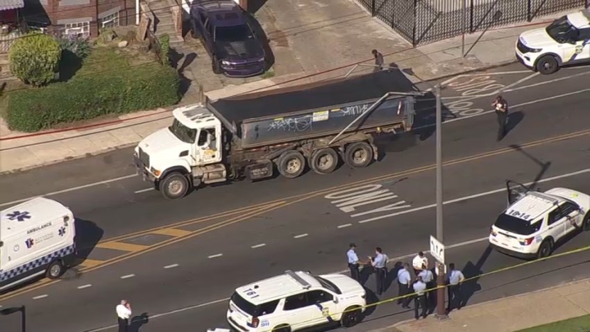 Police investigate after a man was stuck and killed by a dump truck along Cobbs Creek Parkway on Thursday morning.